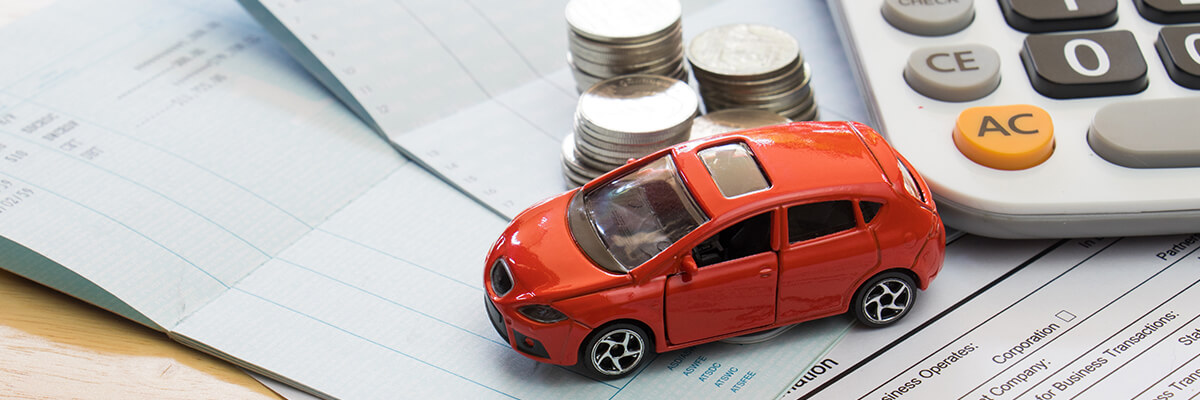 toy car on insurance papers