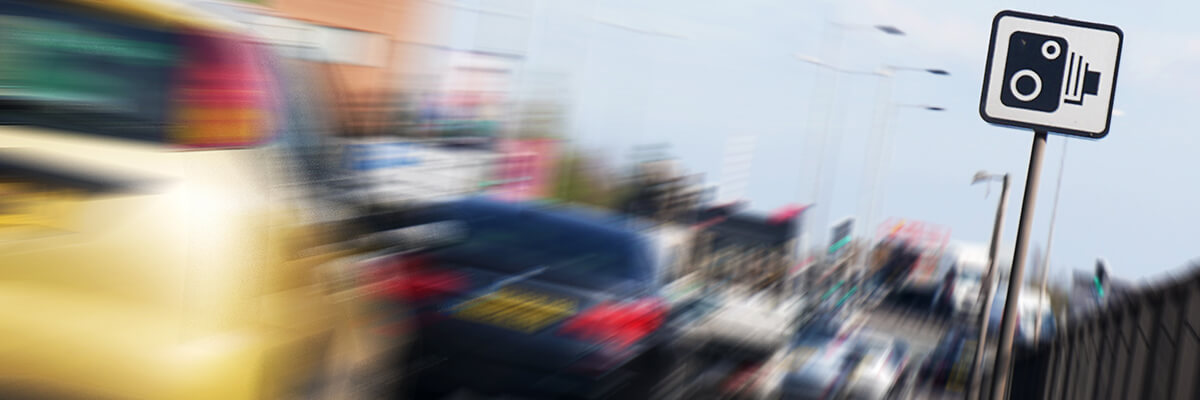 speed camera on road sign