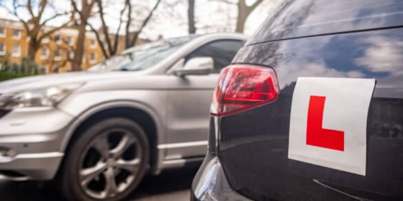 Car parked with an L-plate sticker attached