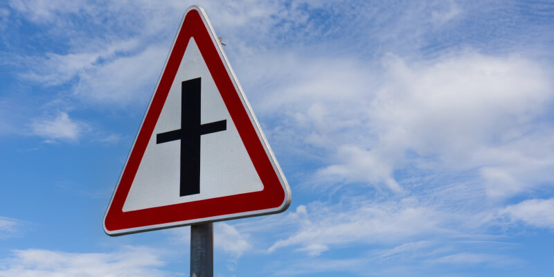 Red triangle with crossroad sign displayed