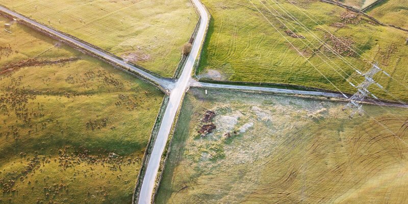 Aerial view of crossroads amongst fields